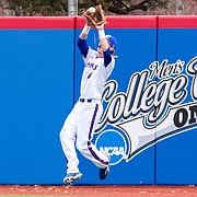 Kansas outfielder Rudy Karre makes a leaping catch in right field during a Jayhawks' game against Murray State at Hoglund Ballpark during the 2015 season. 