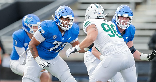 Buffalo right tackle Deondre Doiron prepares to block Ohio defensive end Bryce Stai during a game at UB Stadium on Oct. 16, 2021.