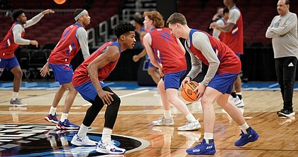Kansas guard Ochai Agbaji (30) gets down to defend against Kansas guard Christian Braun (2) during practice on Thursday, March 24, 2022 at United Center in Chicago.