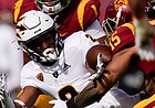 Arizona State wide receiver LV Bunkley-Shelton is tackled by USC safety Talanoa Hufanga during a game on Nov. 7, 2020, in Los Angeles.