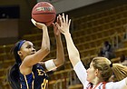 East Tennessee State guard Erica Haynes-Overton, left, shoots over Mercer center Rachel Selph in the second half of the Southern Conference tournament final on March 4, 2018, in Asheville, N.C.