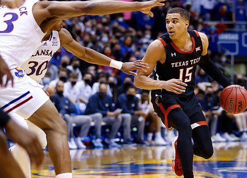 Not yet withdrawn from the NBA draft, Texas Tech transfer Kevin McCullar Jr. commits to play for Kansas if he returns to school