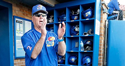 Kansas coach Ritch Price cheers from the dugout during a game against Northwestern State at Hoglund Ballpark on March 4, 2017.