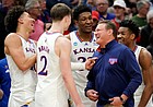 Kansas head coach Bill Self laughs with several of his starters as the Jayhawks begin to celebrate their 76-50 win over Miami to advance to the Final Four.