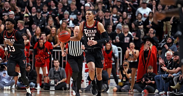 Texas Tech's Kevin McCullar (15) dribbles the ball down the court during the second half of an NCAA college basketball game against Texas, Tuesday, Feb. 1, 2022, in Lubbock, Texas. (AP Photo/Brad Tollefson)