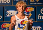 Lawrence's Tanner Newkirk shows off his future uniform during his visit to the University of Kansas, where he signed to run cross country and track starting in the fall of 2022. 