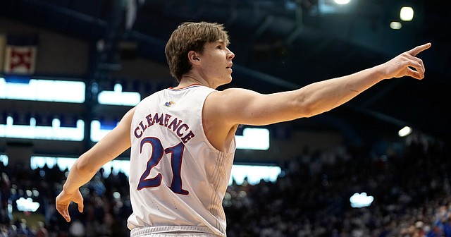 Kansas forward Zach Clemence (21) points to the Kansas students late in the second half on Saturday, Feb. 12, 2022 at Allen Fieldhouse.