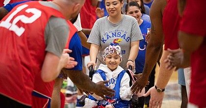 Fatima Gomez, a member of the 2022 Starting Five at The Rock Chalk Roundball Classic, makes her way through player introductions at Free State High School on Thursday, June 9, 2022.