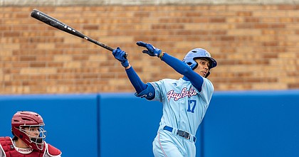 Kansas shortstop Maui Ahuna takes a swing during a game against Oklahoma at Hoglund Ballpark on April 22, 2022.