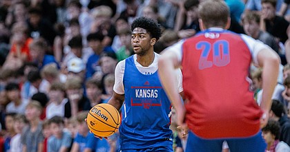 Guard Kyle Cuffe Jr. looks to pass the ball during the team scrimmage at the annual Bill Self Basketball Camp on Wednesday, June 8, 2022 at Allen Fieldhouse. 