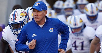 Kansas head coach Lance Leipold takes the field with his team before facing TCU on Nov. 20, 2021, in Fort Worth, Texas.