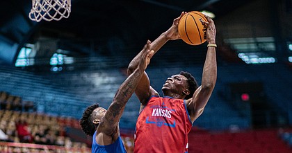 KU center Ernest Udeh Jr. goes for a layup during the team scrimmage at the annual Bill Self Basketball Camp on Wednesday, June 8, 2022 at Allen Fieldhouse. 