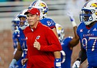 Kansas football coach Lance Leipold leads his players onto the field before the start of the game against Coastal Carolina on Sept. 10, 2021, in Conway, S.C.