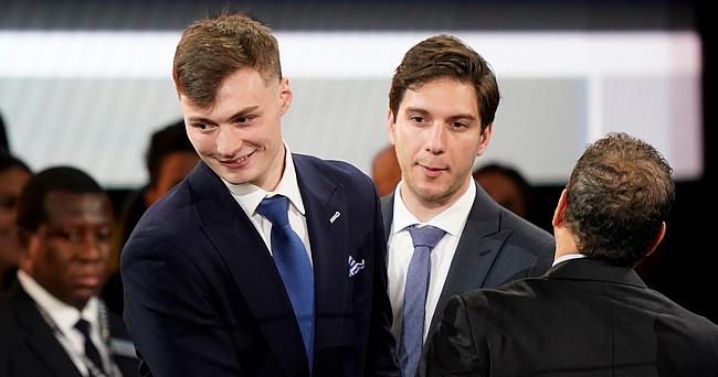 Christian Braun, left, reacts after being selected 21st overall by the Denver Nuggets in the NBA basketball draft, Thursday, June 23, 2022, in New York. (AP Photo/John Minchillo)


