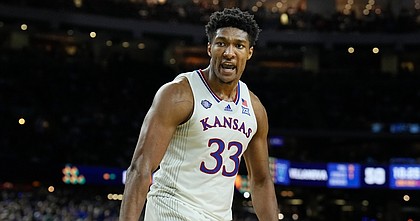 Kansas forward David McCormack reacts to a play during the second half of a college basketball game against Villanova in the semifinal round of the Men's Final Four NCAA tournament, Saturday, April 2, 2022, in New Orleans. (AP Photo/Brynn Anderson)