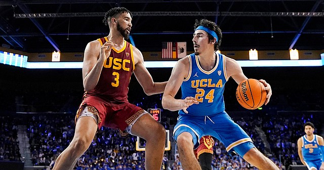 UCLA guard Jaime Jaquez Jr., right, tries to get by USC forward Isaiah Mobley during a game on March 5, 2022, in Los Angeles. UCLA and USC are leaving the Pac-12 for the Big Ten in a seismic change that could lead to another major realignment of college sports.