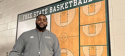Kansas great Sherron Collins, now the boys basketball coach at Free State High, poses for a portrait on June 22, 2022, at Free State High School.