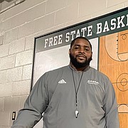 Kansas great Sherron Collins, now the boys basketball coach at Free State High, poses for a portrait on June 22, 2022, at Free State High School.