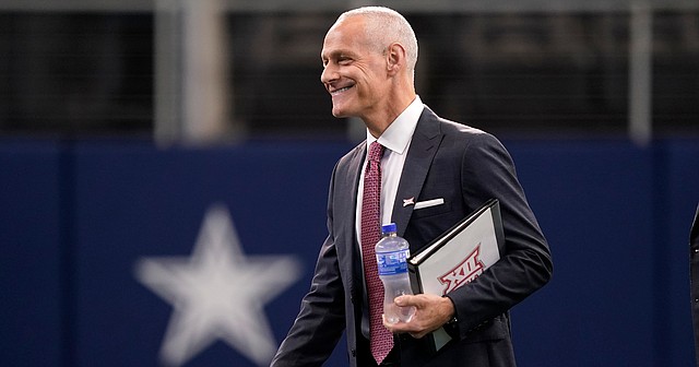 Incoming Big 12 Commissioner Brett Yormark smiles before for a news conference opening the NCAA college football Big 12 media days in Arlington, Texas, Wednesday, July 13, 2022. (AP Photo/LM Otero)