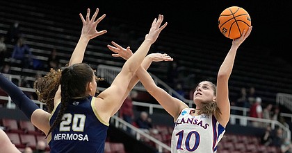 Kansas forward Ioanna Chatzileonti shoots over Georgia Tech center Nerea Hermosa during a first-round NCAA tournament game on March 18, 2022, in Stanford, Calif.