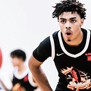 Four-star combo guard Chris Johnson committed to Kansas on Aug. 2, 2022, making him the Jayhawks' first commitment in the Class of 2023. 