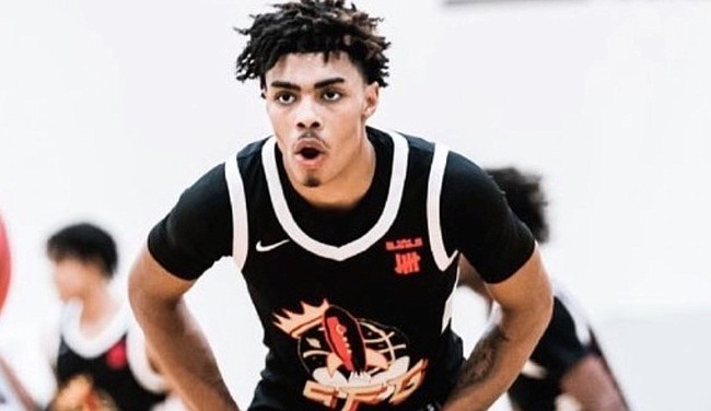 Four-star combo guard Chris Johnson committed to Kansas on Aug. 2, 2022, making him the Jayhawks' first commitment in the Class of 2023. 