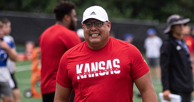 Kansas defensive analyst Oscar Rodriguez Jr., the former interim head coach at Akron and a two-time cancer survivor, walks on the sideline during a training camp practice on Aug. 3, 2022.