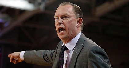 East Carolina head coach Joe Dooley protests a call during the first half of an NCAA college basketball game against Houston in Greenville, N.C., Wednesday, Jan. 29, 2020. (AP Photo/Karl B DeBlaker)