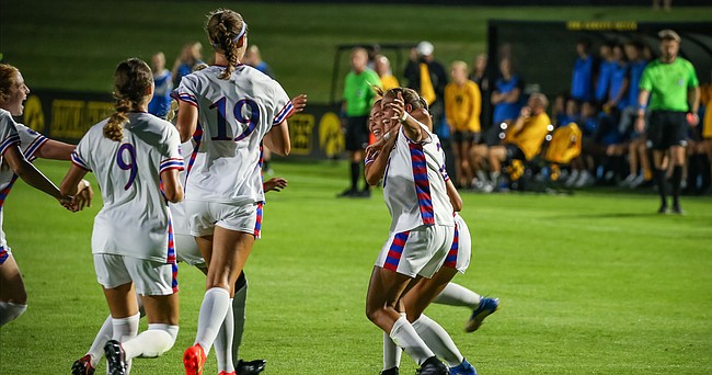 The Kansas women's soccer team celebrates a second-half goal by Shira Elinav in the Jayhawks' 1-0 win at Iowa on Thursday, Aug. 25, 2022. 