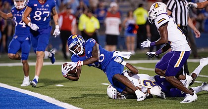 Kansas running back Sevion Morrison (28) falls into the end zone for a touchdown against Tennessee Tech during the fourth quarter on Friday, Sept. 2, 2022 at Memorial Stadium.