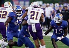 Kansas defensive end Lonnie Phelps (47) closes in on Tennessee Tech running back David Gist (21) with Kansas linebacker Craig Young (15) and Kansas defensive lineman Caleb Taylor (53) during the first quarter on Friday, Sept. 2, 2022 at Memorial Stadium.