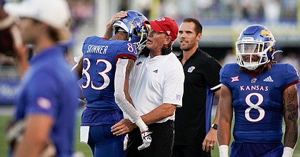 Kansas head coach Lance Leipold gives a hug to Kansas wide receiver Quentin Skinner (83) after Skinner pulled in a deep catch to set up a Kansas touchdown during the first quarter on Friday, Sept. 2, 2022 at Memorial Stadium.