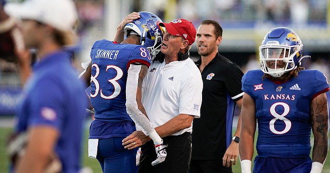Kansas head coach Lance Leipold gives a hug to Kansas wide receiver Quentin Skinner (83) after Skinner pulled in a deep catch to set up a Kansas touchdown during the first quarter on Friday, Sept. 2, 2022 at Memorial Stadium.