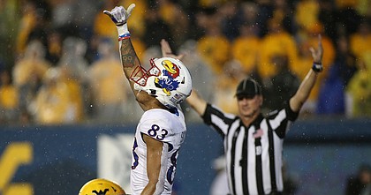 Kansas wide receiver Quentin Skinner (83) celebrates after a touchdown during overtime of an NCAA college football game against West Virginia in Morgantown, W.Va., Saturday, Sept. 10, 2022. (AP Photo/Kathleen Batten)


