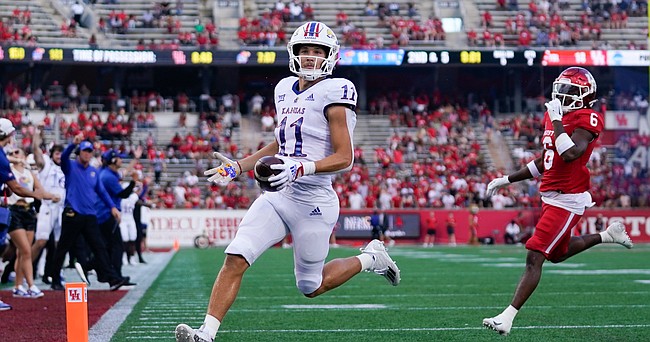 Kansas wide receiver Luke Grimm (11) runs in to the end zone for a touchdown during the first half of an NCAA college football game against Houston, Saturday, Sept. 17, 2022, in Houston. (AP Photo/Eric Christian Smith)