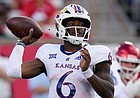 Kansas quarterback Jalon Daniels looks to throw a pass during the first half of an NCAA college football game against Houston, Saturday, Sept. 17, 2022, in Houston. (AP Photo/Eric Christian Smith)