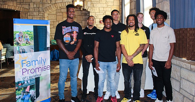 Kansas men's basketball players, from left, KJ Adams, Dajuan Harris Jr., Joe Yesufu, Bobby Pettiford, Michael Jankovich, Jalen Wilson and Kyle Cuffe Jr., are pictured during Family Promise of Lawrence's annual auction fundraiser, which featured the Jayhawks donating $17,000 themselves to the organization that helps combat homelessness for families in Douglas County. KU forward Cam Martin, who is not pictured, was also at the event. 