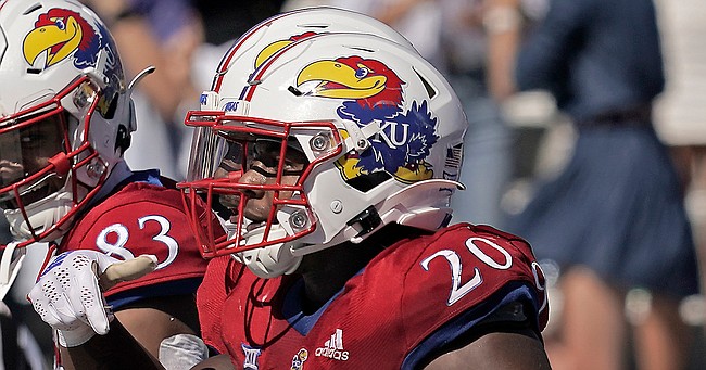 Kansas running back Daniel Hishaw Jr. (20) celebrates after scoring a touchdown during the first half of an NCAA college football game against Duke Saturday, Sept. 24, 2022, in Lawrence, Kan. (AP Photo/Charlie Riedel)