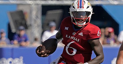 Kansas quarterback Jalon Daniels runs the ball during the first half of an NCAA college football game against Duke Saturday, Sept. 24, 2022, in Lawrence, Kan. (AP Photo/Charlie Riedel)