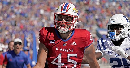 Kansas tight end Trevor Kardell is chased by Duke defensive back Joshua Pickett as he scores a touchdown during the first half of a game on Sept. 24, 2022, in Lawrence, Kan.