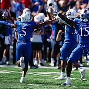 Kansas linebacker Craig Young (15) and the defense celebrate a missed Iowa State field goal attempt during the first quarter on Saturday, Oct. 1, 2022 at Memorial Stadium.