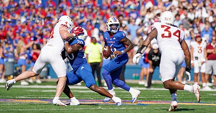 Kansas quarterback Jalon Daniels (6) drops back to pass against Iowa State during the first quarter on Saturday, Oct. 1, 2022 at Memorial Stadium.