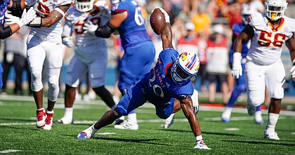 Kansas running back Daniel Hishaw Jr. (20) regains his footing as he throws himself into the end zone for a touchdown during the second quarter against Iowa State on Saturday, Oct. 1, 2022 at Memorial Stadium.