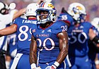 Kansas running back Daniel Hishaw Jr. (20) celebrates after a review confirmed his touchdown during the second quarter on Saturday, Oct. 1, 2022 at Memorial Stadium.