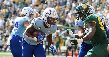 Kansas running back Devin Neal scores a touchdown against Baylor in the second half of an NCAA college football game, Saturday, Oct. 22, 2022, in Waco, Texas. (AP Photo/Jerry Larson)


