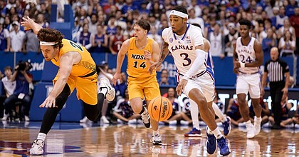 Kansas guard Dajuan Harris Jr. (3) pushes the ball up the court against North Dakota State during the first half, Thursday, Nov. 10, 2022 at Allen Fieldhouse.