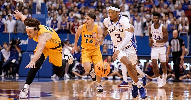 Kansas guard Dajuan Harris Jr. (3) pushes the ball up the court against North Dakota State during the first half, Thursday, Nov. 10, 2022 at Allen Fieldhouse.