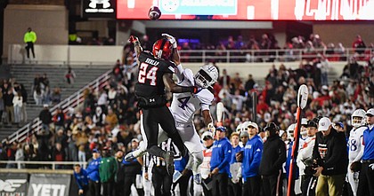 Texas Tech defensive back Malik Dunlap (24) breaks up a pass intended for Kansas running back Devin Neal (4) during the first half of an NCAA college football game, Saturday, Nov. 12, 2022, in Lubbock, Texas. (AP Photo/Justin Rex)


