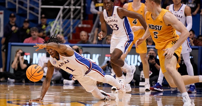 Kansas guard Joseph Yesufu (1) lays out on the floor for a loose ball against North Dakota State during the second half, Thursday, Nov. 10, 2022 at Allen Fieldhouse.