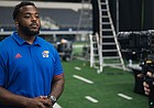 Kansas defensive lineman Caleb Sampson films a commercial for the Big 12 Champions for Life campaign last summer. Sampson was chosen for the project to represent all of KU student-athletes. 